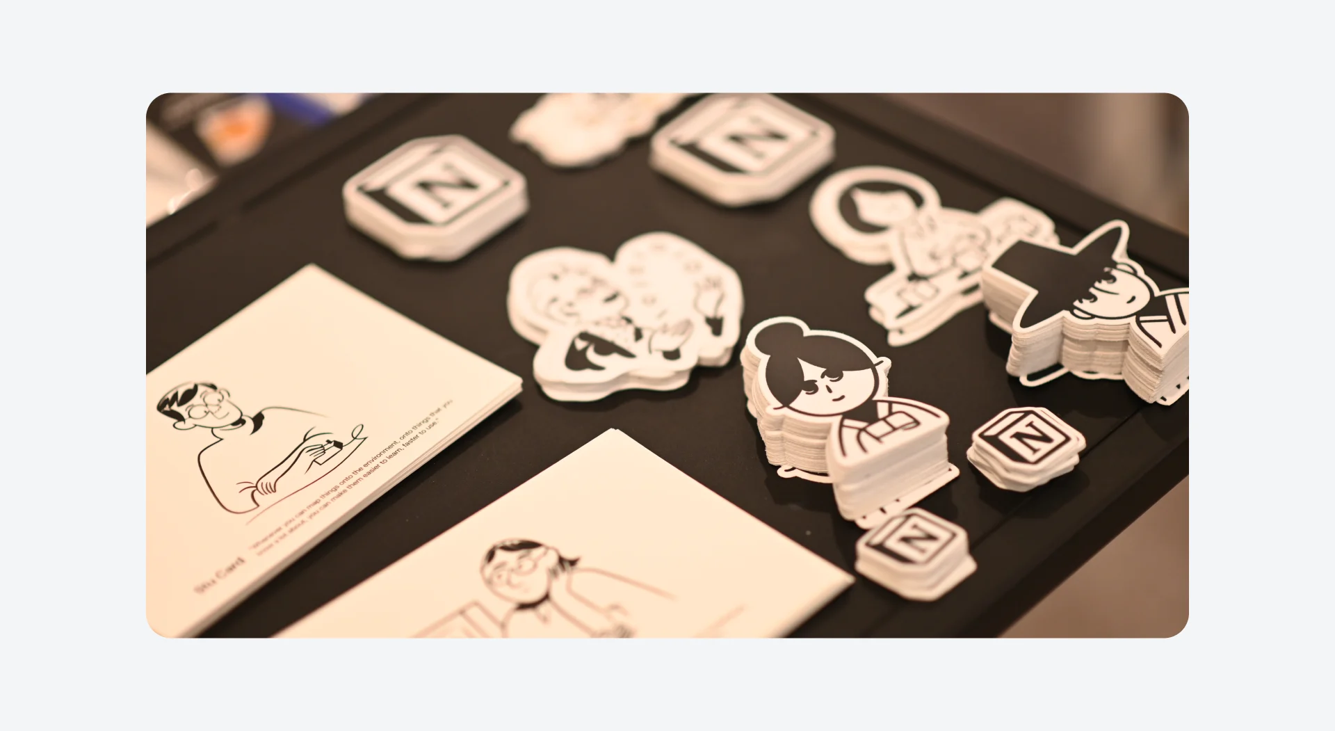 Event merchandise from Notion, LottieFiles, and Wanted